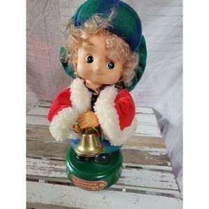 Padma girl caroler motion at Xmas home decor